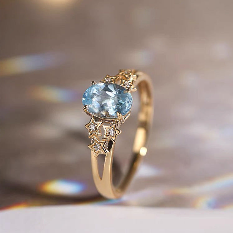 青いクリスタルのエクスクルーシブゴールドリング